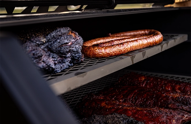 Meat cooking on offset smoker